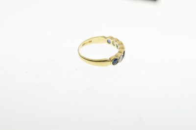 Lot 29 - 18ct gold half hoop ring, set with four sapphire and three brilliant cut diamonds