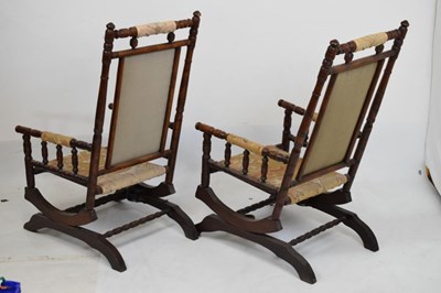 Lot 666 - Pair of late 19th Century American rocking chairs