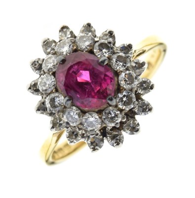 Lot 20 - Ruby and diamond 18ct gold cluster ring