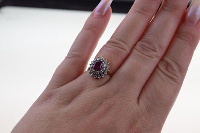 Lot 20 - Ruby and diamond 18ct gold cluster ring