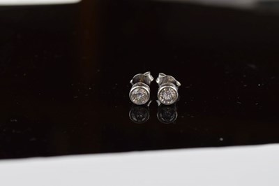 Lot 43 - Pair of diamond single stone ear studs