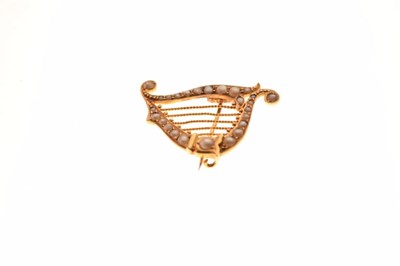 Lot 25 - Yellow metal seed pearl harp brooch