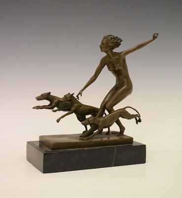 Lot 221 - Art Deco style lady with dogs signed 'Lorenzl', on a black marble base