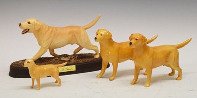 Lot 278 - Beswick model of a Labrador in matt finish, together with three other Beswick Labrador figures