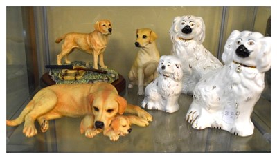 Lot 295 - Three Beswick Staffordshire style spaniels, together with other Labrador figures