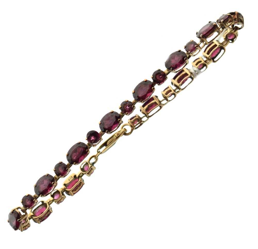 Lot 42 - 9ct gold bracelet set purple stones