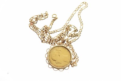 Lot 40 - Coins - Victorian gold sovereign 1880, within yellow metal mount, on a 9ct gold Figaro chain