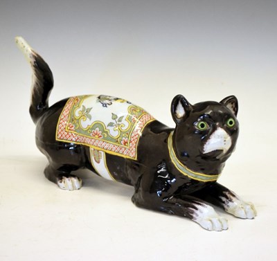 Lot 235 - French faience model of a black and white cat