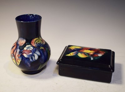 Lot 392 - Moorcroft pottery 'Orchid' pattern bulbous vase and lidded box