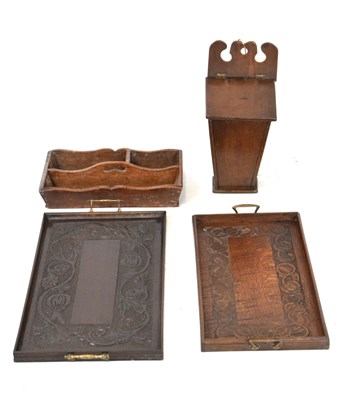 Lot 617 - Oak candle box together with two carved oak trays and an oak cutlery tray