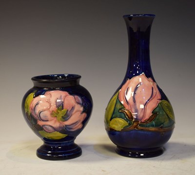 Lot 397 - Two Moorcroft pottery 'Magnolia' pattern vases