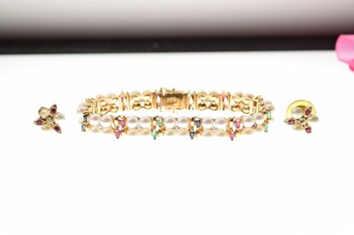 Lot 21 - Cultured pearl, diamond, ruby, sapphire and emerald bracelet