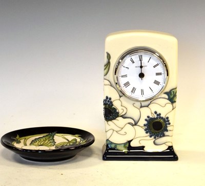 Lot 316 - Moorcroft pottery mantel clock with floral decoration on a cream ground