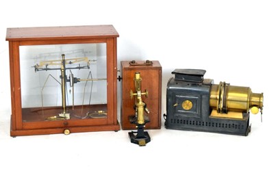 Lot 744 - R&J Beck Ltd, London, microscope cased together with an Atent magic lantern projector