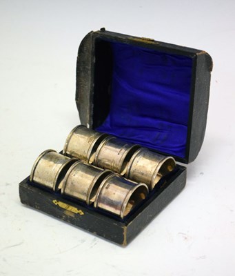 Lot 144 - George V cased of six napkin rings