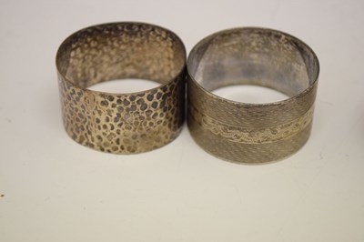 Lot 146 - Three Edward VII silver napkin rings, together with four mixed napkins (7)