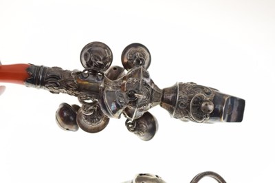 Lot 102 - 19th Century child's white metal rattle with coral teether, and acorn rattle (2)