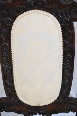 Lot 365 - Pair of reproduction chairs with carved decoration and padded backs