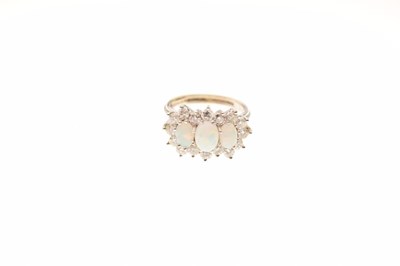 Lot 16 - 18ct white gold, opal and diamond cluster ring