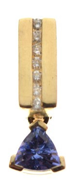 Lot 69 - Pair of 14k, tanzanite and diamond set ear studs, and a matching pendant