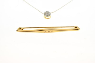 Lot 56 - 750 yellow metal and diamond bar brooch,, a 9ct brooch, and a 9ct pendant with chain