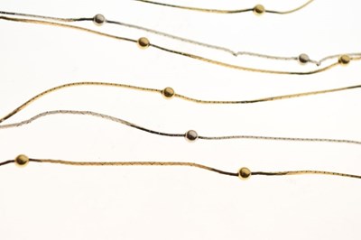 Lot 61 - Three row two-colour necklace with ball spacers, stamped '750'