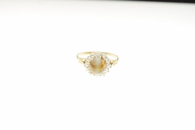 Lot 7 - 'Cats eye' cabochon and diamond cluster ring