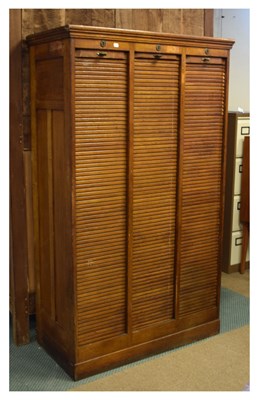 Lot 699 - Triple tambour fronted oak filing cabinet