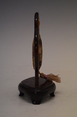 Lot 408 - Chinese jade 'Bi' disc on hardwood stand