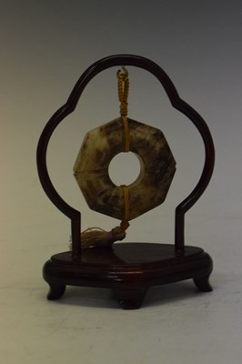 Lot 408 - Chinese jade 'Bi' disc on hardwood stand