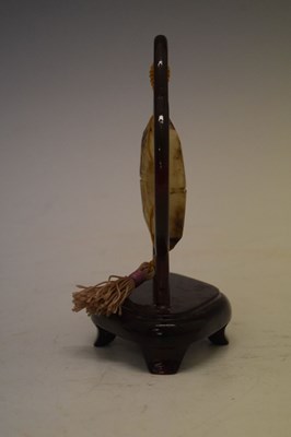 Lot 408 - Chinese jade 'Bi' disc on hardwood stand