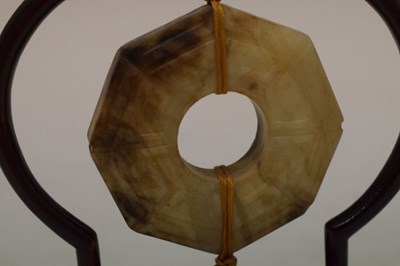 Lot 408 - Chinese jade 'Bi' disc on hardwood stand