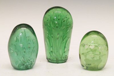 Lot 310 - Three green glass 'dump' paperweights