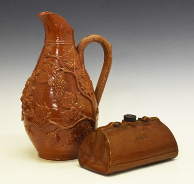 Lot 339 - Victorian stoneware relief-moulded wine jug and hot water bottle