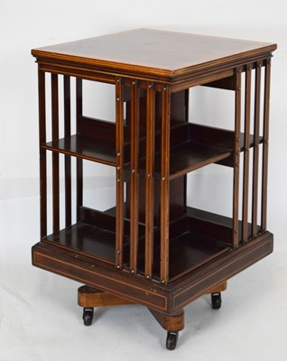 Lot 605 - 20th Century inlaid mahogany revolving bookcase