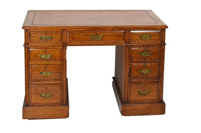 Lot 598 - Late Victorian/Edwardian oak twin pedestal kneehole desk