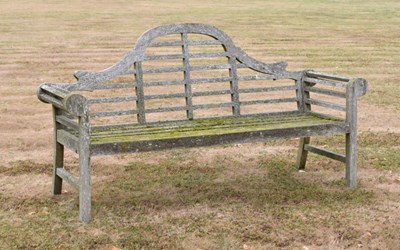 Lot 520 - Lutyens style weathered teak garden bench