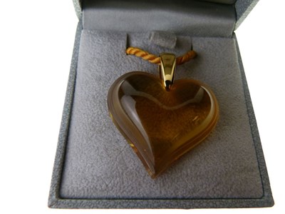 Lot 31 - Lalique, a citrine-coloured glass heart pendant
