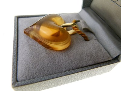 Lot 31 - Lalique, a citrine-coloured glass heart pendant