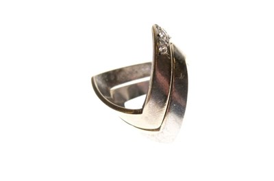 Lot 14 - Two white metal wishbone design rings
