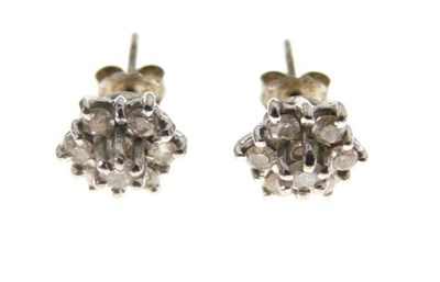 Lot 29 - Pair of seven-stone diamond cluster ear studs