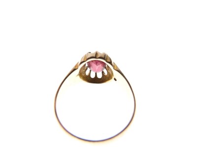 Lot 23 - 9ct gold ring, claw set an oval garnet-coloured stone