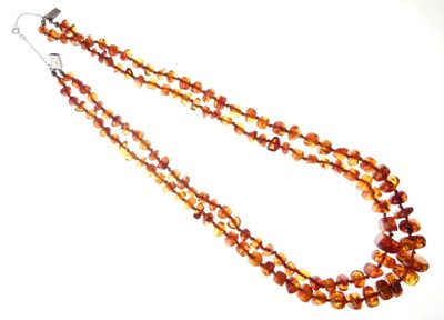 Lot 35 - Two-row amber graduated bead necklace