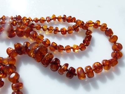 Lot 35 - Two-row amber graduated bead necklace