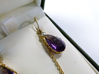 Lot 27 - Pendant set faceted purple stone and seed pearls