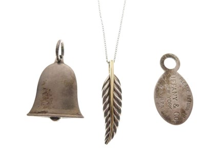 Lot 84 - Tiffany & Co - A silver and gold feather pendant