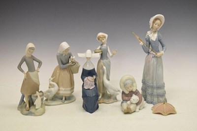 Lot 385 - Lladro - Six porcelain figures including gees figure groups