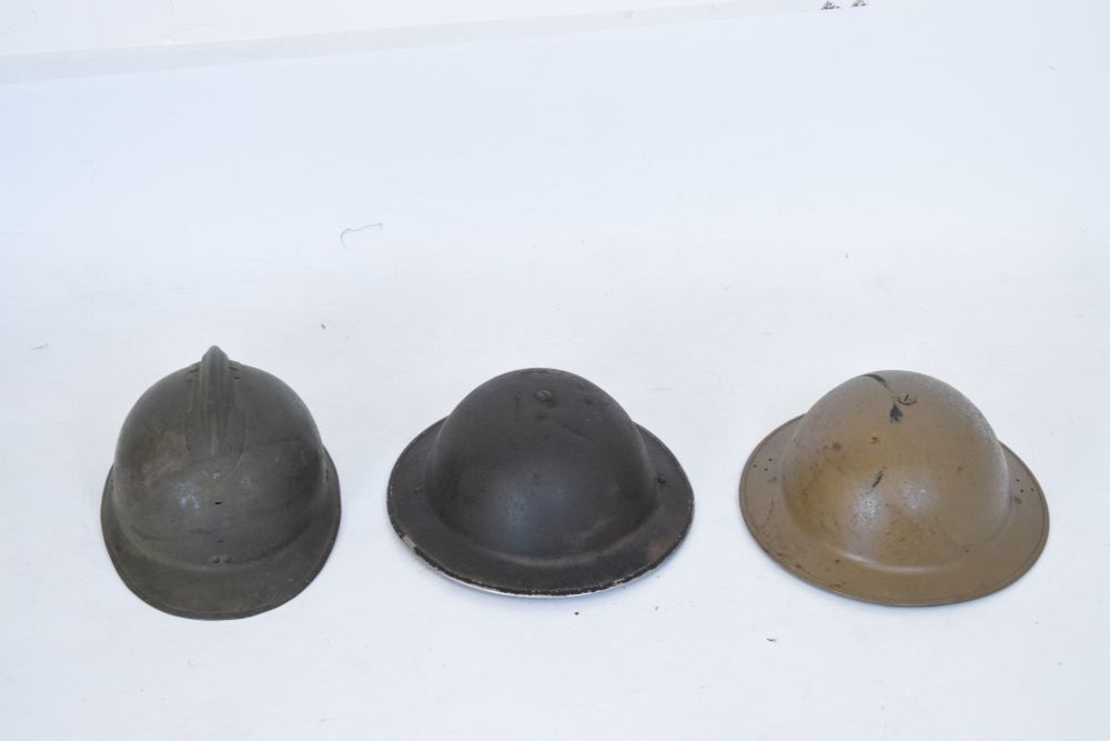 Lot 426 French Adrian steel helmet and two British