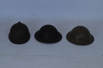 Lot 426 French Adrian steel helmet and two British