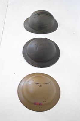 Lot 426 - French 'Adrian' steel helmet and two British 'Brodie' steel helmets